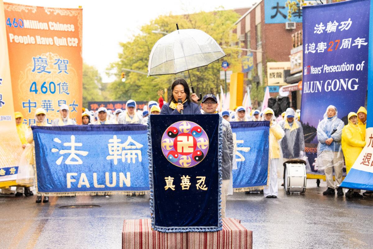 He Ai-shan, a Falun Gong practitioner, speaks at a rally commemorating the 27th anniversary of the April 25 appeal, in Flushing, New York, on April 25, 2026. (Larry Dye/The Epoch Times)