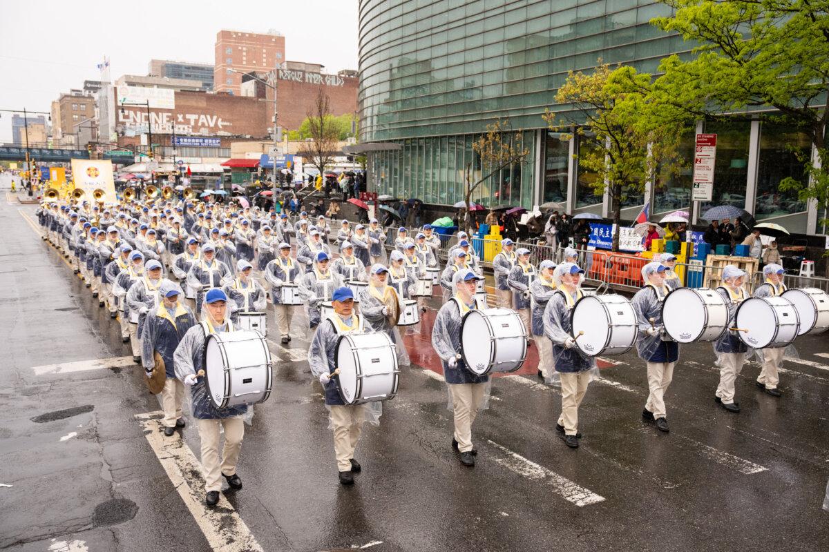 A marching band at a parade commemorating the 27th anniversary of the April 25 appeal, in Flushing, New York, on April 25, 2026. (Larry Dye/The Epoch Times)