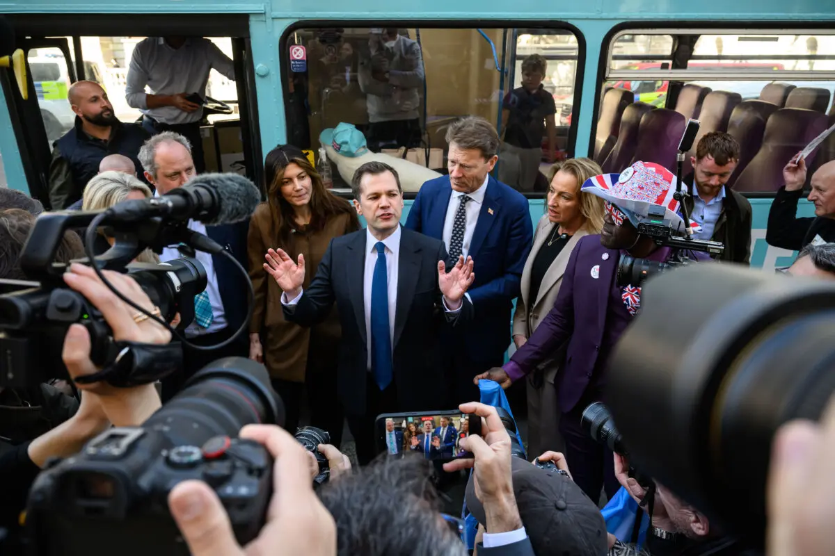 Treasury Spokesperson for the Reform UK party Robert Jenrick (C) speaks to the media during a photo call in London on April 27, 2026. (Leon Neal/Getty Images)