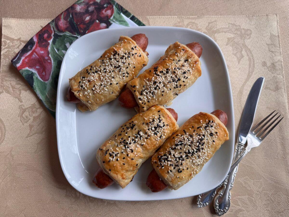 Golden pastry wraps around spiced sausage and melted cheese for a warm, crowd-pleasing centerpiece. (JeanMarie Brownson/TCA)