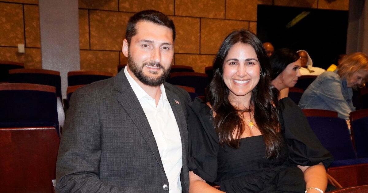 Austin Ekonomou, with a guest, attended the Shen Yun Performing Arts performance at Dr. Phillips Center for the Performing Arts on April 27, 2026. (Nancy Ma/The Epoch Times)