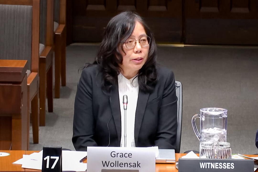 Grace Wollensak, national coordinator of the Falun Dafa Association of Canada, testifies before the House of Commons Subcommittee on International Human Rights in Ottawa, Canada, on April 20, 2026. Wollensak warned that to cancel the show is to fall into Beijing’s “trap.” (House of Commons/Screenshot via The Epoch Times)