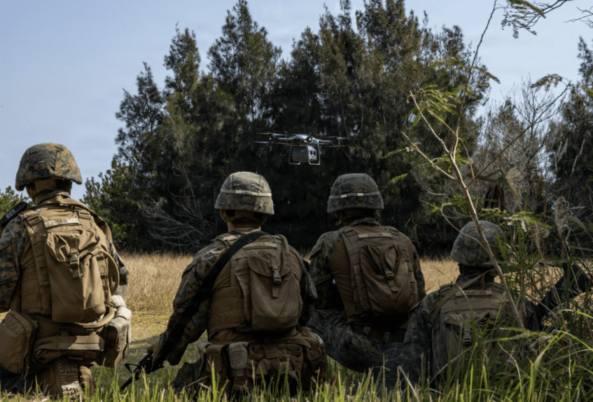 U.S. Marines assigned to the 31st Marine Expeditionary Unit retrieve an equipment delivery from a a Tactical Resupply Unmanned Aircraft System, during a training exercise at a landing zone in Okinawa, Japan, on Feb. 4, 2026. (U.S. Marine Corps photo by Cpl. Rebeka Falcon)