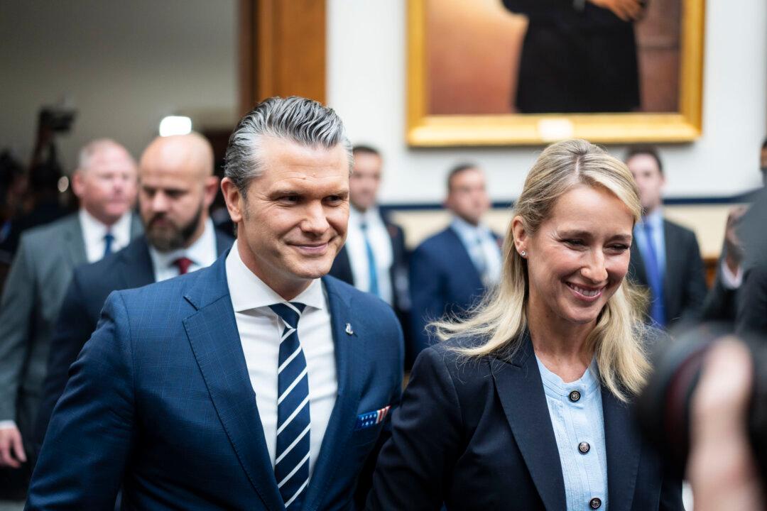 Secretary of War Pete Hegseth and his wife Jennifer Hegseth arrive on Capitol Hill in Washington on April 29, 2026. (Madalina Kilroy/The Epoch Times)