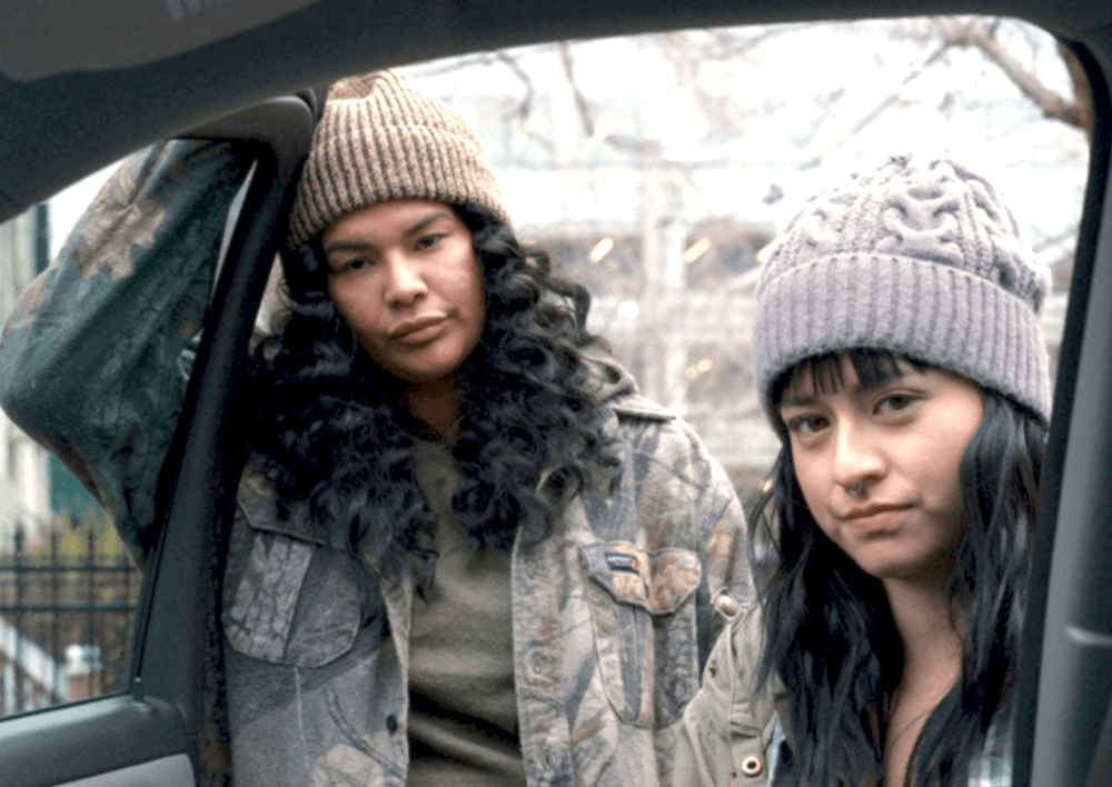 Nika (Ellyn Jade) and Madison (Star Slade) listen to advice from a reservation elder, in “Nika & Madison.” (Game Theory Films)