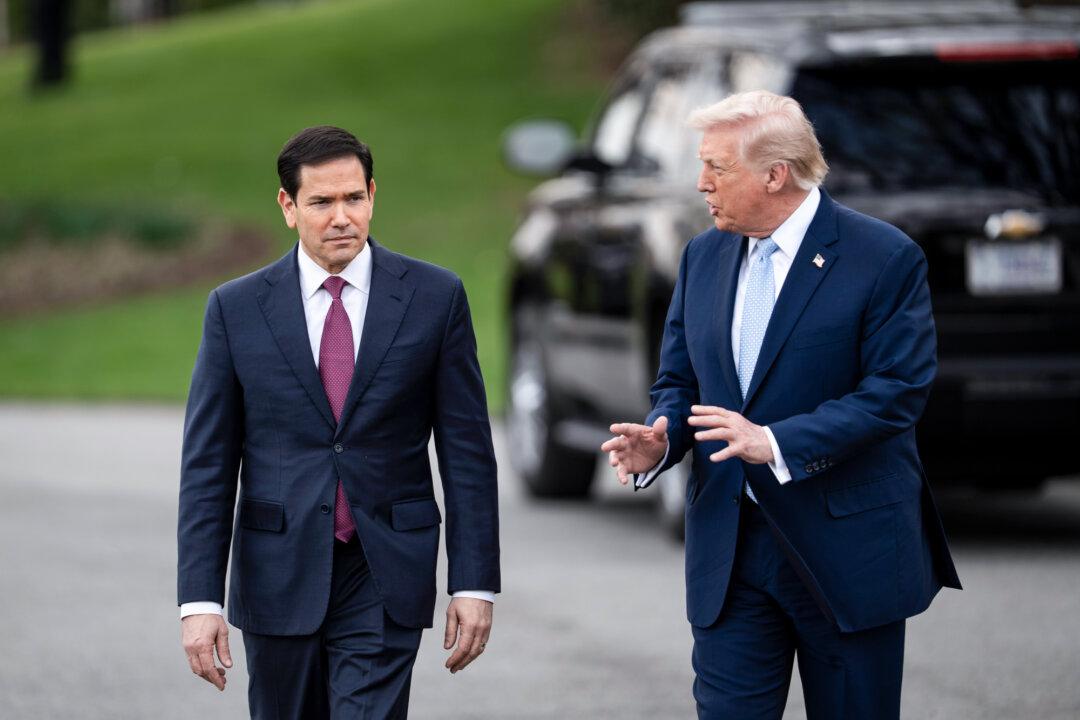 Secretary of State Marco Rubio and President Donald Trump walk toward the press as they depart the White House on March 20, 2026. In an April 30 call with Rubio, Chinese Foreign Minister Wang Yi called Taiwan “the biggest risk factor” in bilateral ties, according to a Chinese readout. (Madalina Kilroy/The Epoch Times)