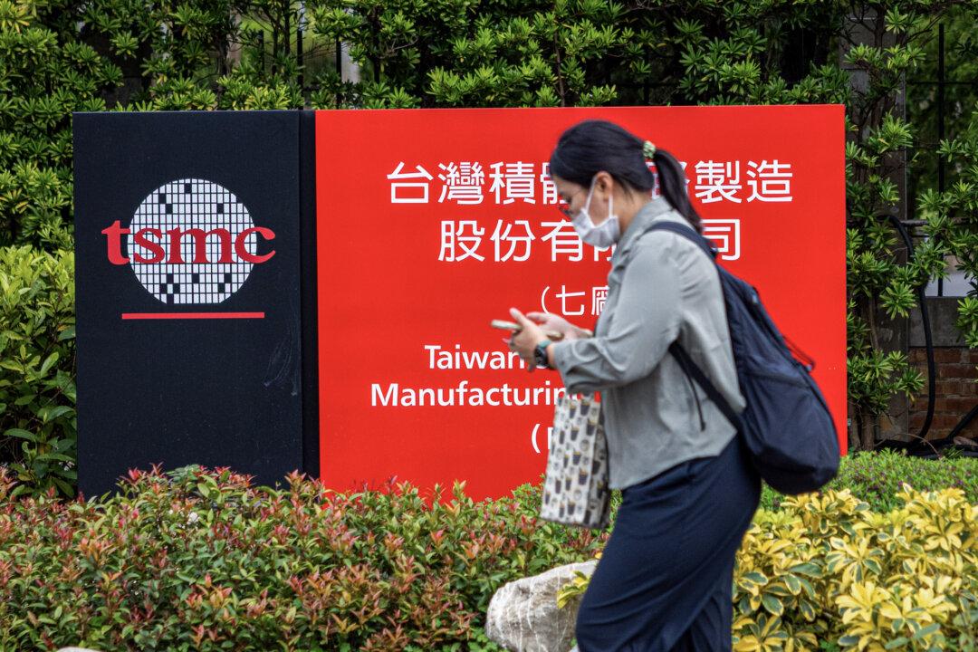 A person walks past the logo of Taiwan Semiconductor Manufacturing Company at Hsinchu Science Park in Hsinchu, Taiwan, on April 18, 2025. TSMC has ramped up its investment plans in the United States in recent years. (Annabelle Chih/Getty Images)