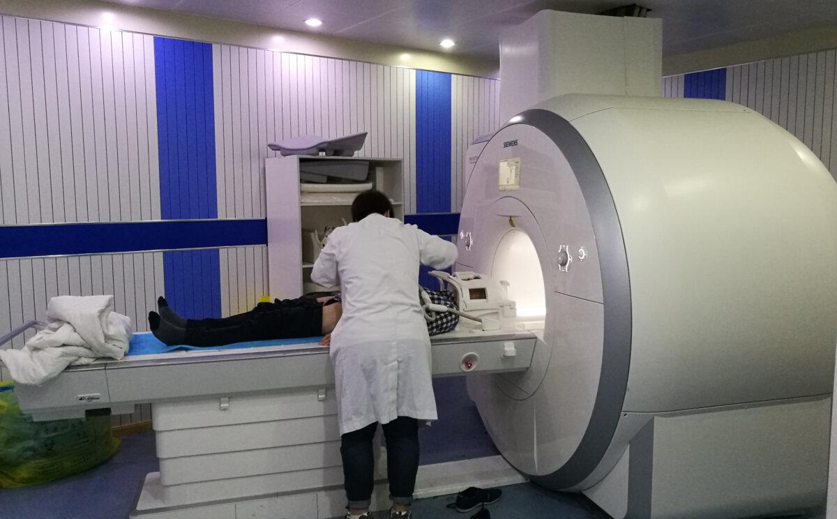 A patient is positioned for an MRI study of the head and abdomen. (<a href="https://commons.wikimedia.org/wiki/User:Ptrump16">Ptrump16</a>/<a href="https://creativecommons.org/licenses/by-sa/4.0">CC BY-SA 4.0</a>)