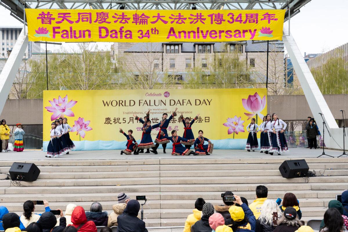 Young Falun Dafa practitioners perform traditional Chinese dances at Nathan Phillips Square in Toronto on May 3, 2026. (Evan Ning/The Epoch Times)