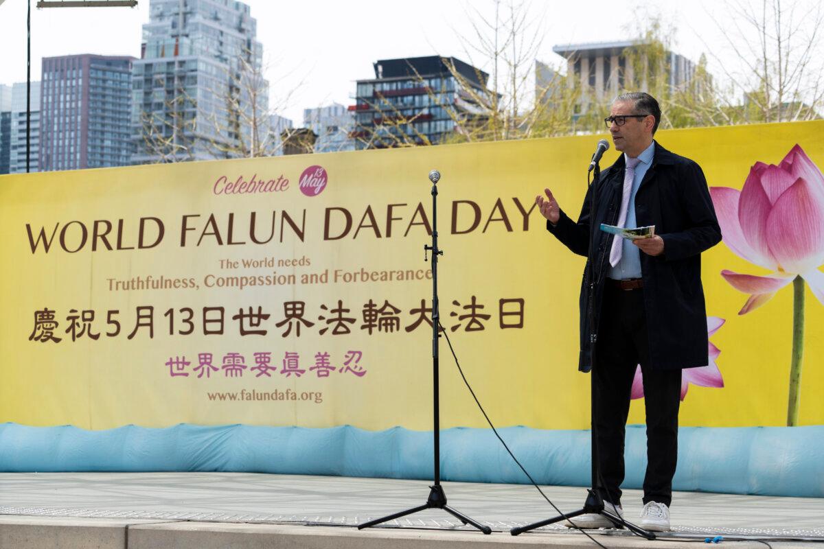 Ardeshir Zarezadeh, executive director of the International Centre for Human Rights in Canada, speaks at a World Falun Dafa Day celebration at Nathan Phillips Square in Toronto on May 3, 2026. (Evan Ning/The Epoch Times)