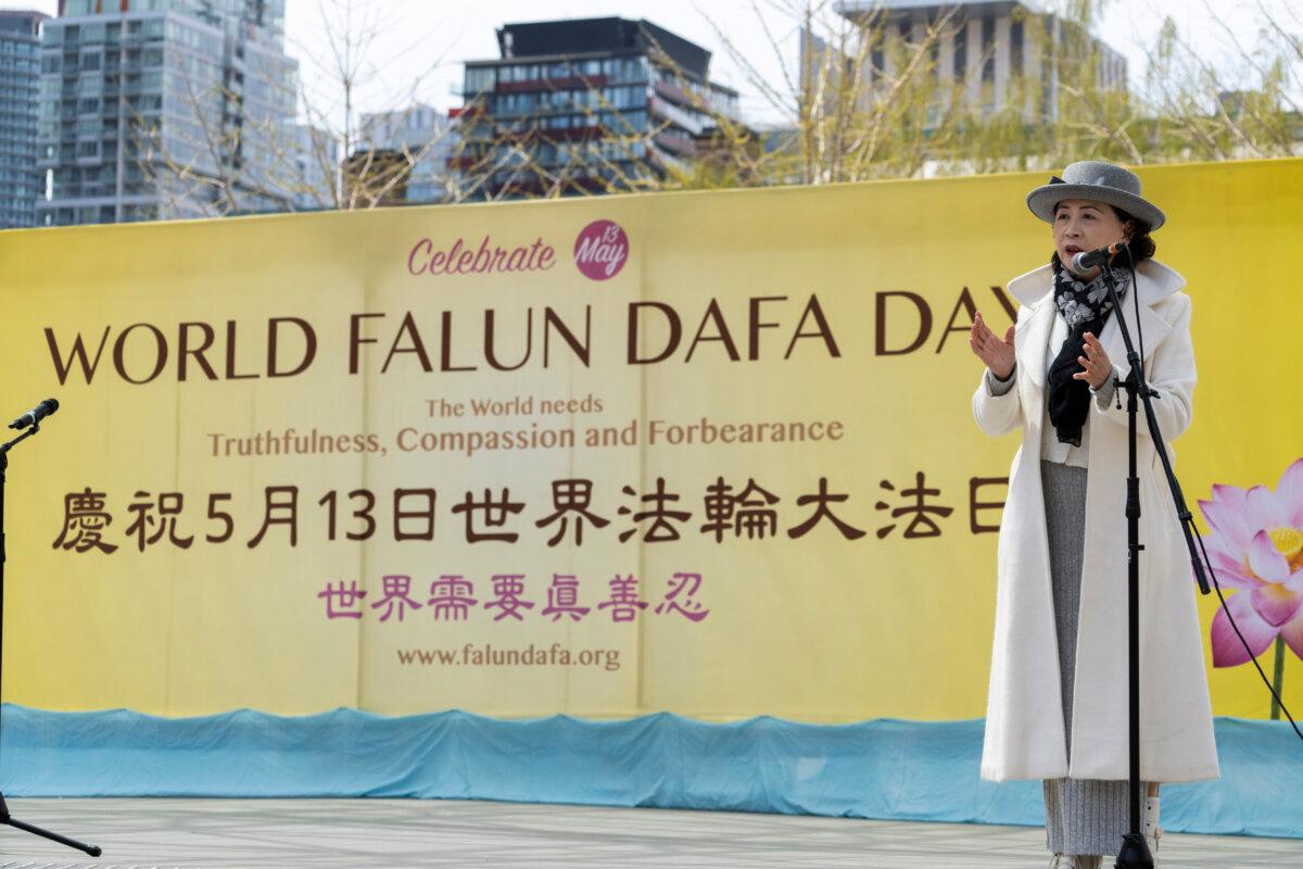 Sheng Xue, a Chinese Canadian and longtime democracy advocate, speaks at a World Falun Dafa Day celebration at Nathan Phillips Square in Toronto on May 3, 2026. (Evan Ning/The Epoch Times)