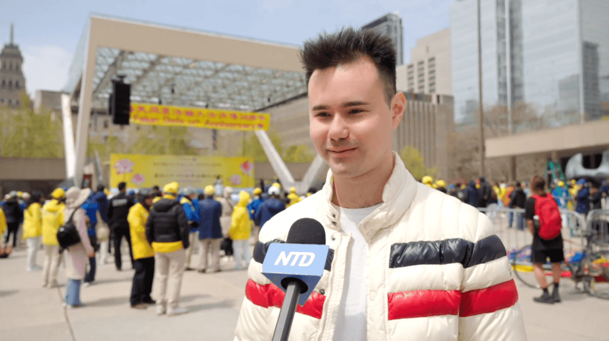 Falun Dafa practitioner Matthew Leeder attends the 34th World Falun Dafa Day celebration at Nathan Phillips Square in Toronto on May 3, 2026. (NTD)