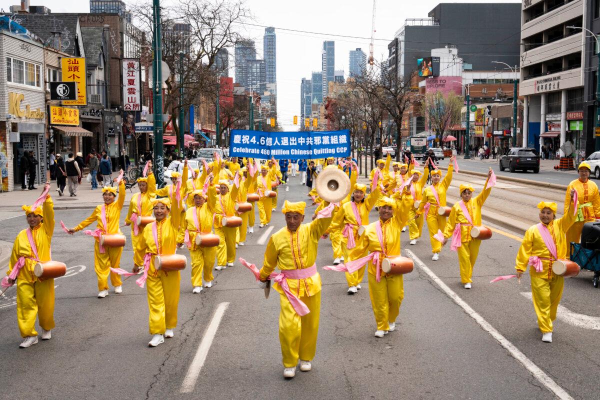 Falun Dafa practitioners participate in a parade in downtown Toronto on May 3, 2026, marking the 34th World Falun Dafa Day. (Evan Ning/The Epoch Times)