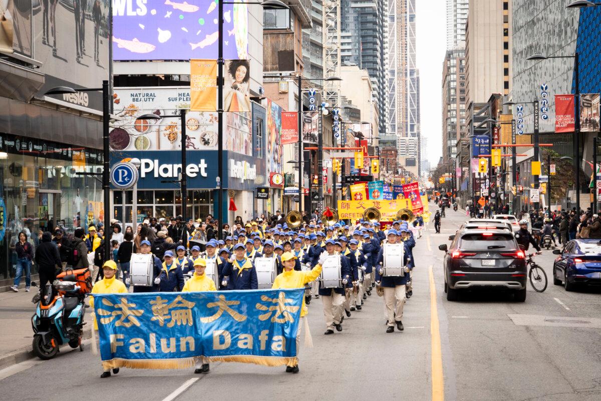 Falun Dafa practitioners participate in a parade in downtown Toronto on May 3, 2026, marking the 34th World Falun Dafa Day. (Evan Ning/The Epoch Times)