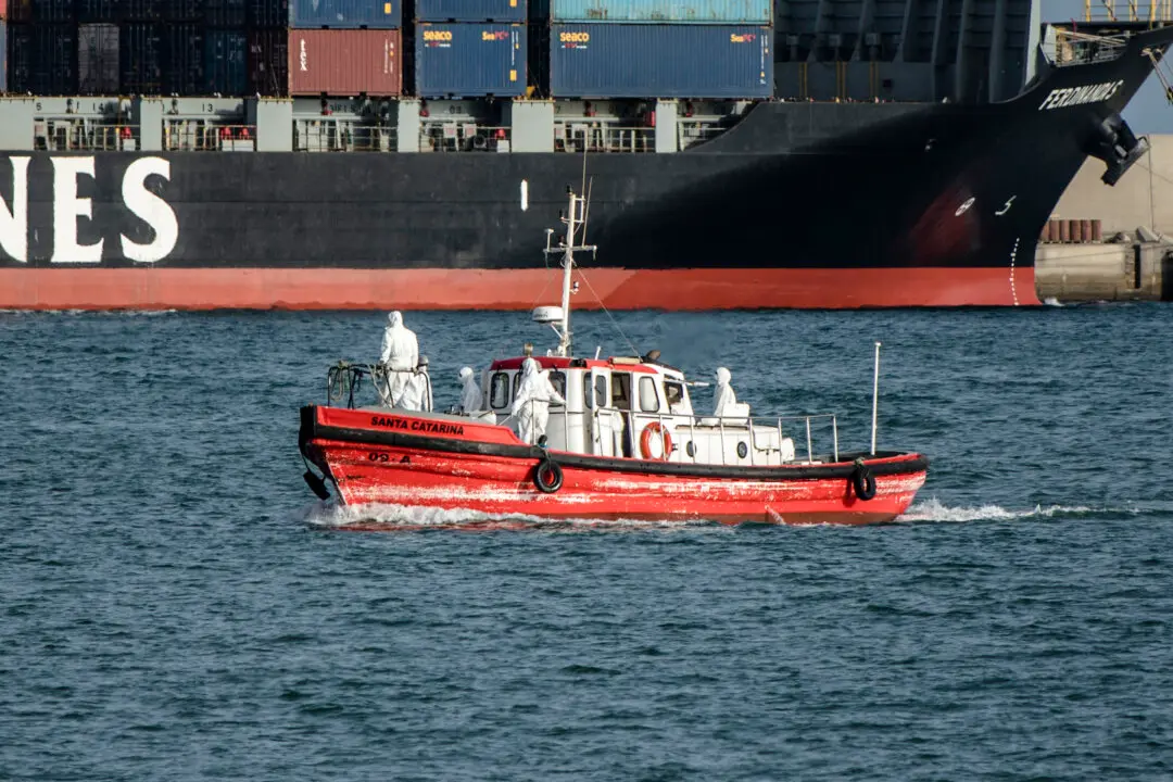 Day in Photos: Cruise Ship Crew Members Evacuated, Transport Strike, and Battle Reenactment