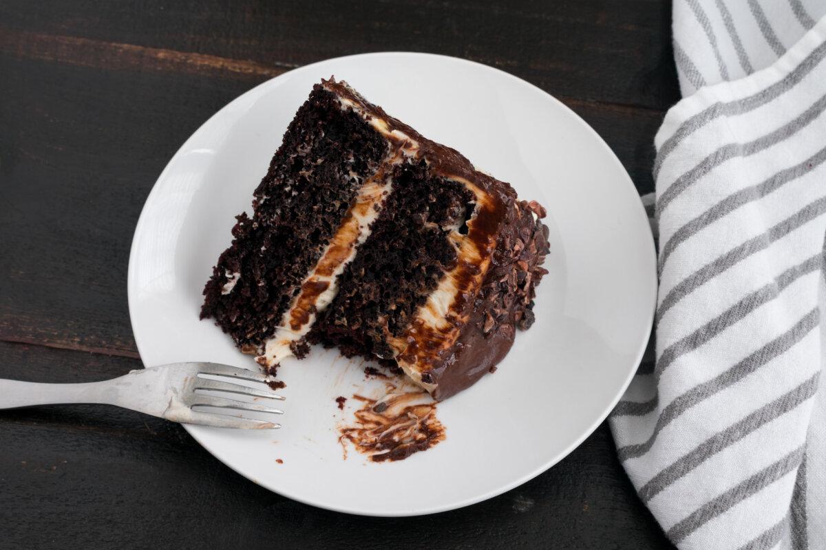 Chocolate cake infused with Guinness delivers deep, bittersweet flavor, finished with a thick layer of cream frosting. (Candice Bell/Shutterstock)