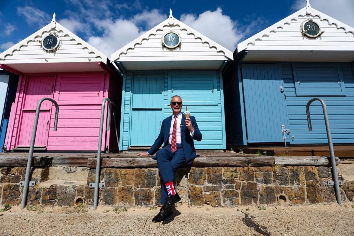 Reform UK leader Nigel Farage poses with an ice cream after casting his vote in the local elections in Walton-on-the-Naze, England, on May 7, 2026. (Chris Radburn/AFP via Getty Images)