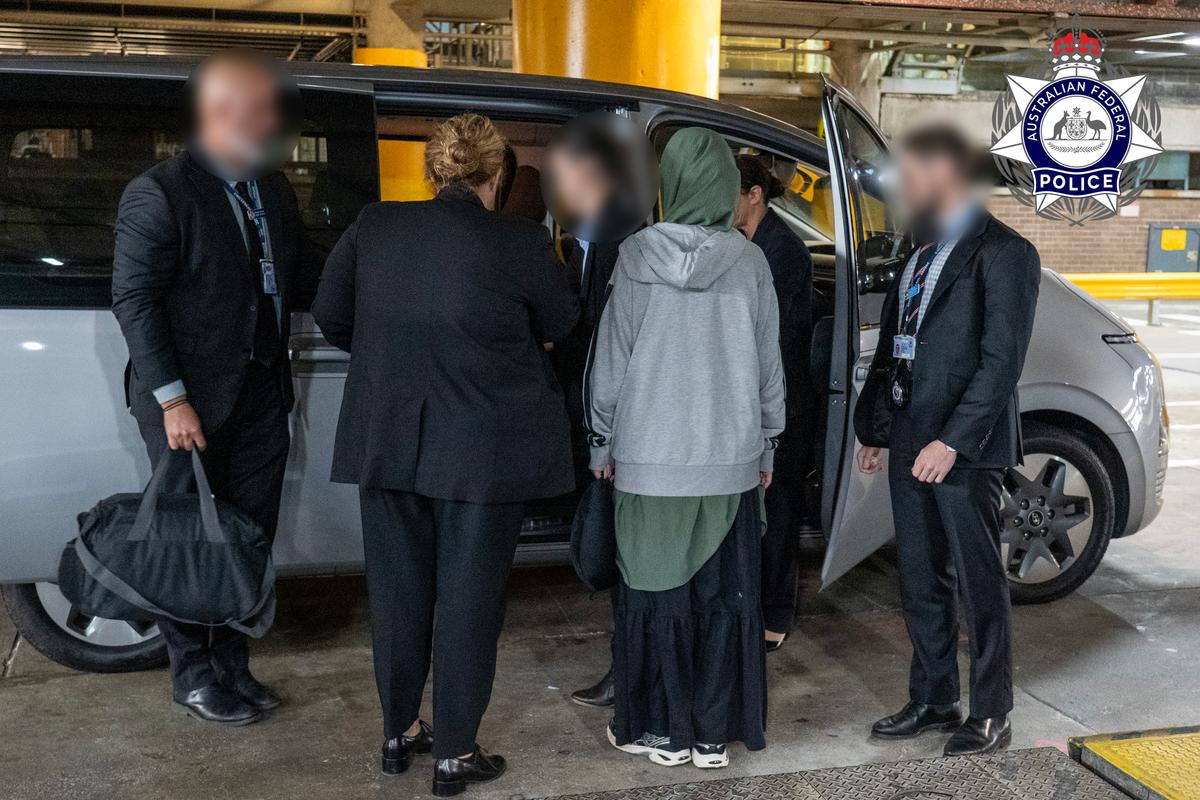 Australian Federal Police escort some of the ISIS cohort in Sydney on the evening of May 7. (Courtesy of the Australian Federal Police)