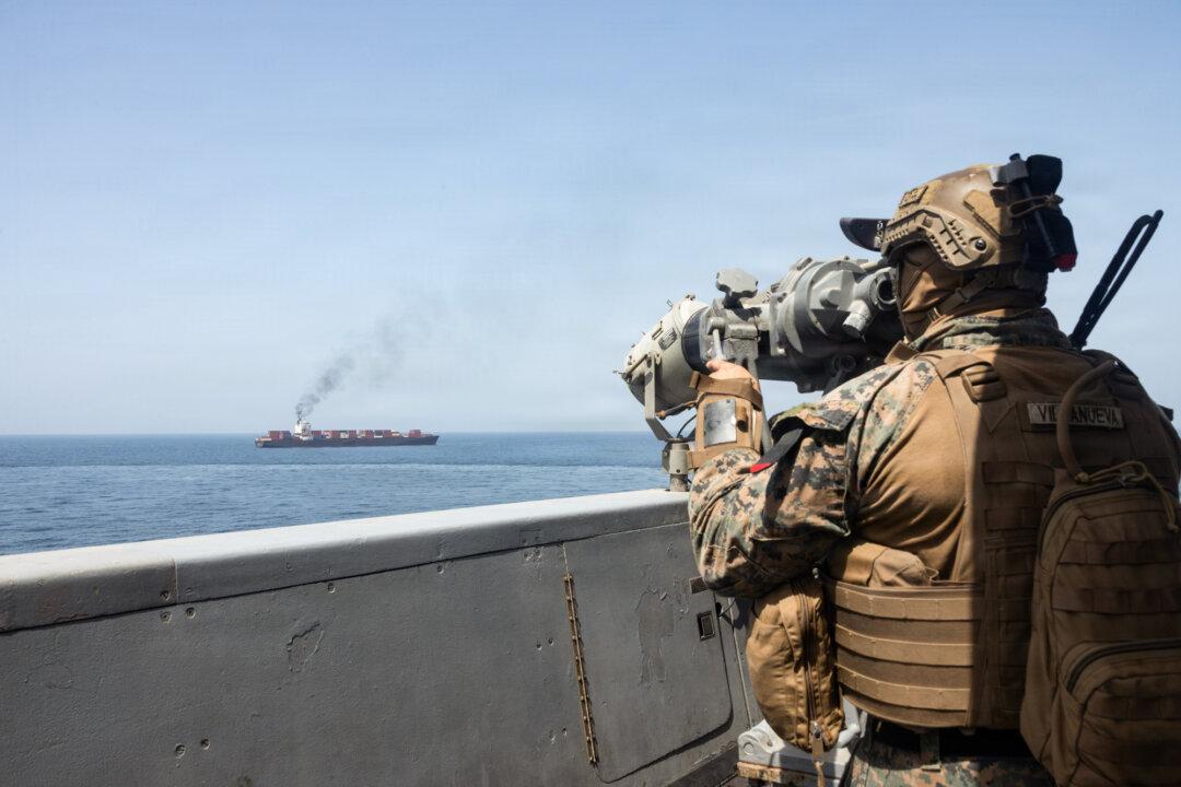 In this handout photo provided by U.S. Central Command, U.S. forces patrol the Arabian Sea near the M/V Touska by the Strait of Hormuz on April 20, 2026. Analysts say Washington is increasing pressure on Tehran ahead of the U.S. president’s mid-May visit to Beijing, a major source of support for the Iranian regime through illicit oil trade. (U.S. Navy via Getty Images)