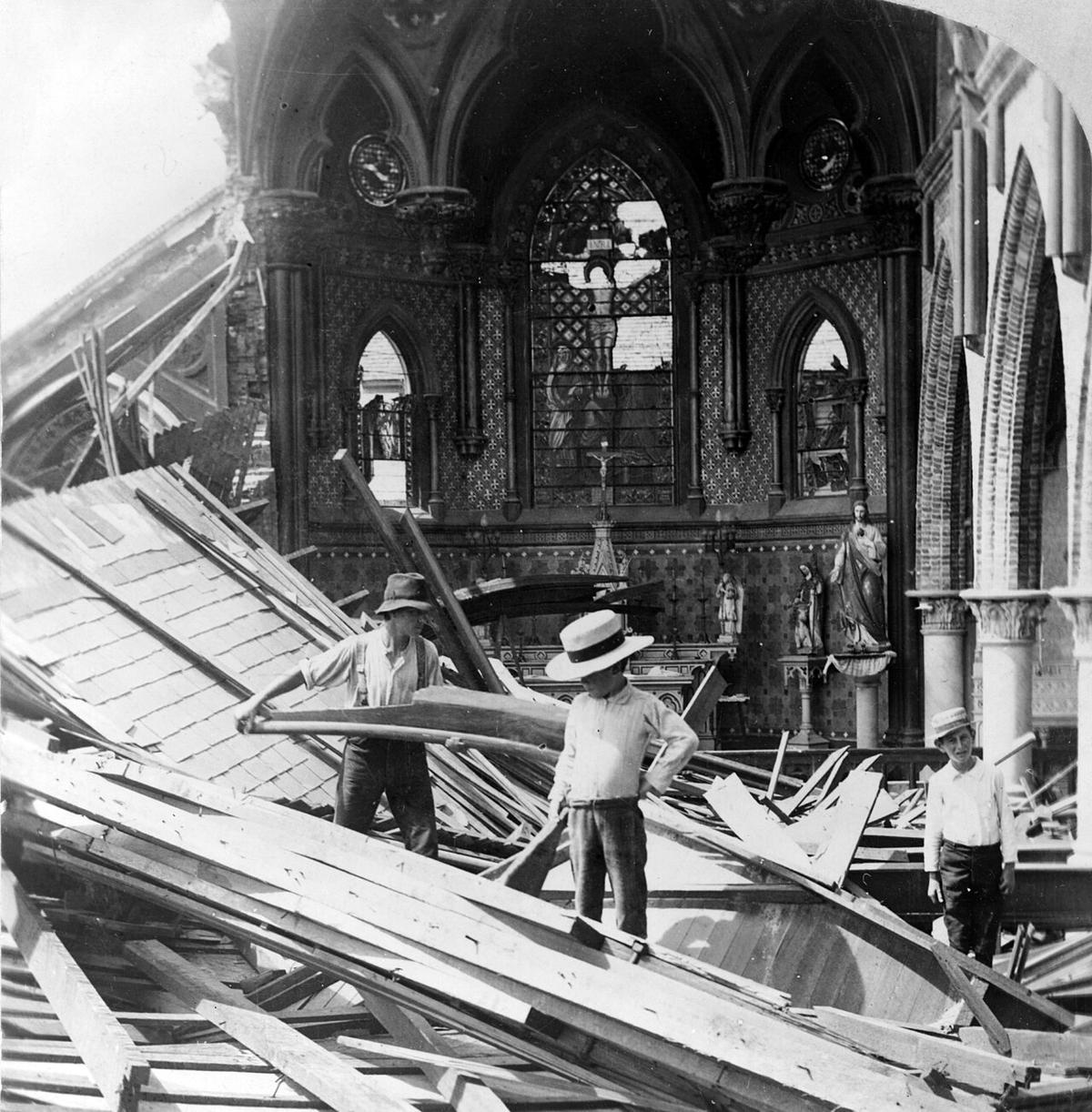 Survivors pick through the wreckage of St. Patrick's Church in Galveston, Texas, after the 1900 hurricane. (Public Domain)
