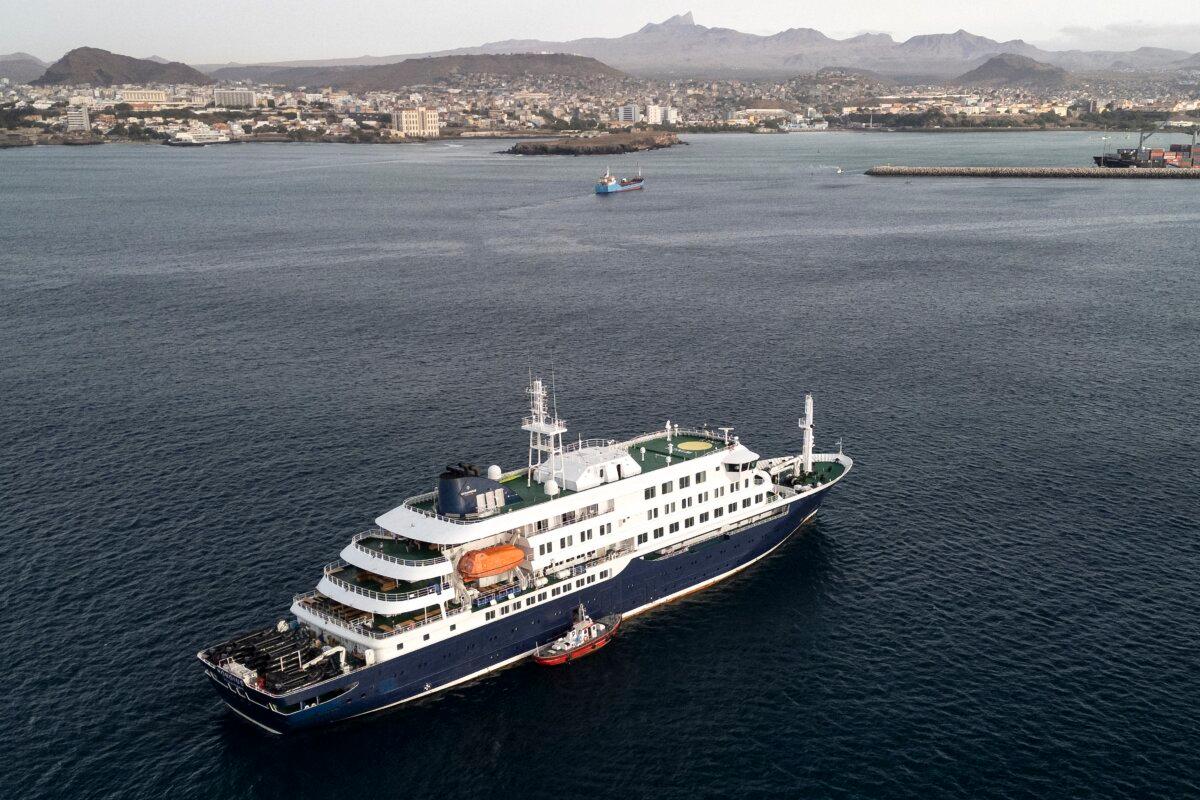 Health personnel board the cruise ship MV Hondius while it is stationary off the port of Praia, the capital of Cape Verde, on May 6, 2026. (AFP via Getty Images)