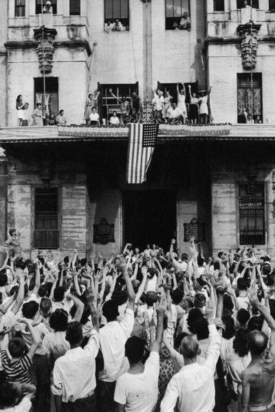 Hundreds of Santo Tomas camp internees in front of the University's main building cheering their release on Feb. 5, 1945. (Public Domain)