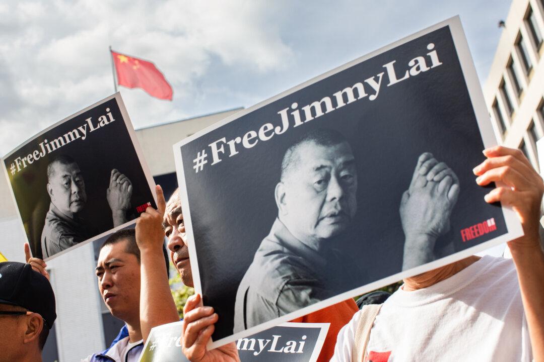 People gather in front of the Chinese Consulate General to protest the conviction of media entrepreneur Jimmy Lai in Los Angeles on Feb. 14, 2026. Claire Lai said her father’s hearing and eyesight have declined in the six years since his imprisonment in Hong Kong, and he has sufffered other health issues. (Apu Gomes/Getty Images)