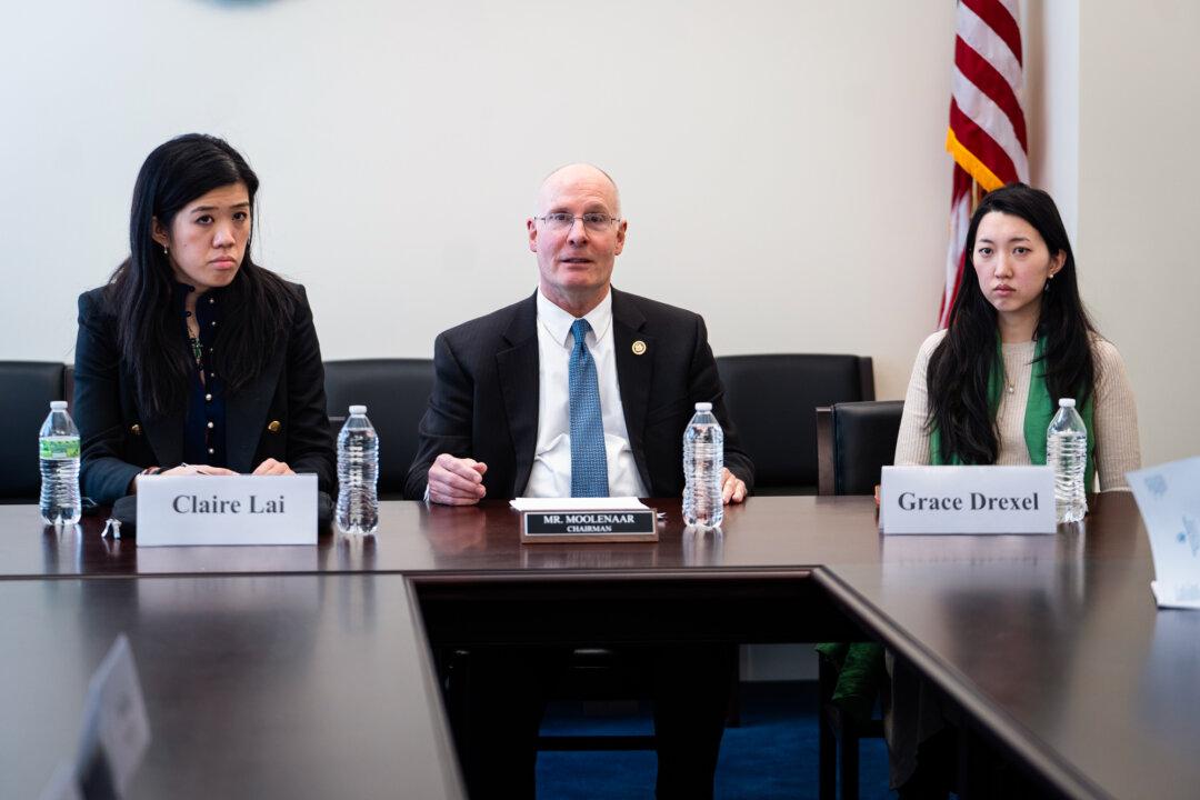 Claire Lai, daughter of Jimmy Lai, founder of shuttered pro-democracy newspaper Apple Daily—who in February was sentenced to 20 years in prison under Hong Kong's national security law—Rep. John Moolenaar (R-Mich.), chairman of the House Select Committee on the Chinese Communist Party, and Grace Jin Drexel, daughter of founding pastor Ezra Jin of Zion Church in Beijing, speak during a press conference on Capitol Hill in Washington on March 19, 2026. (Madalina Kilroy/The Epoch Times)