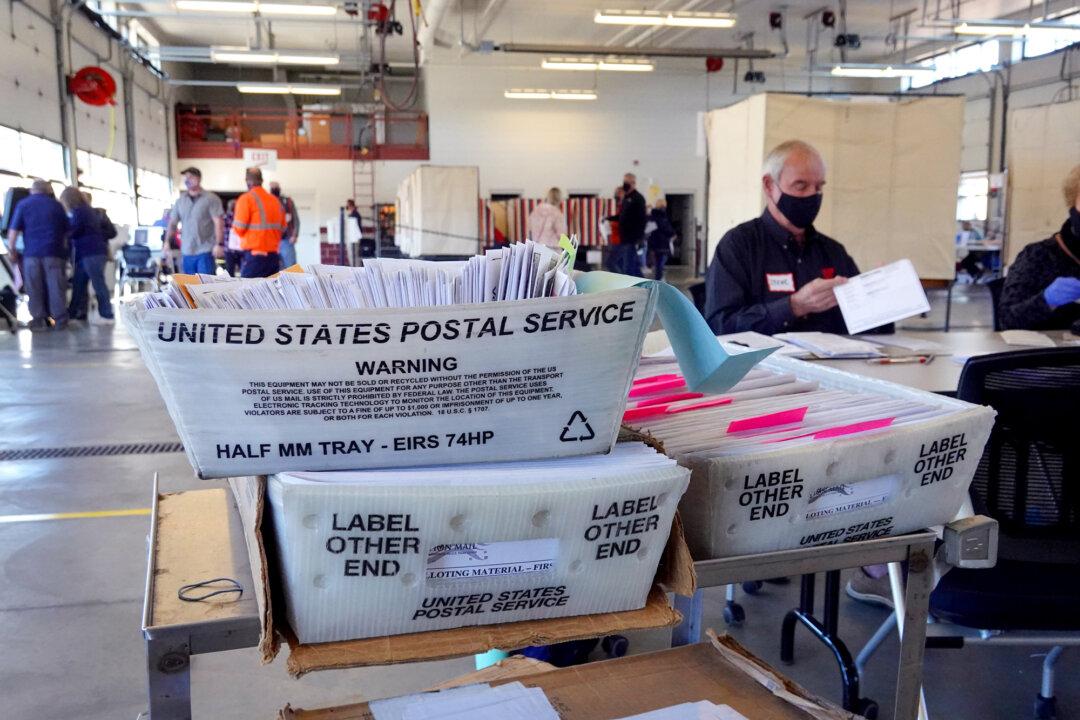 Election officials count absentee ballots at a polling place located in the Town of Beloit fire station near Beloit, Wis., on Nov. 3, 2020. (Scott Olson/Getty Images)