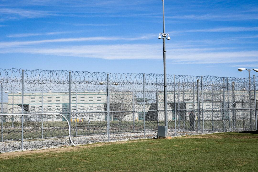 A fence, barbed wire, and a guard are visible at the Allan B. Polunsky Unit, which houses the 169 men on Texas’s death row, in Livingston, Texas, on Jan. 22, 2025. The Supreme Court is expected to weigh whether the 11th Circuit required too much certainty on intellectual disability and should have upheld an Alabama man’s death sentence. (Cécile Clocheret/AFP via Getty Images)