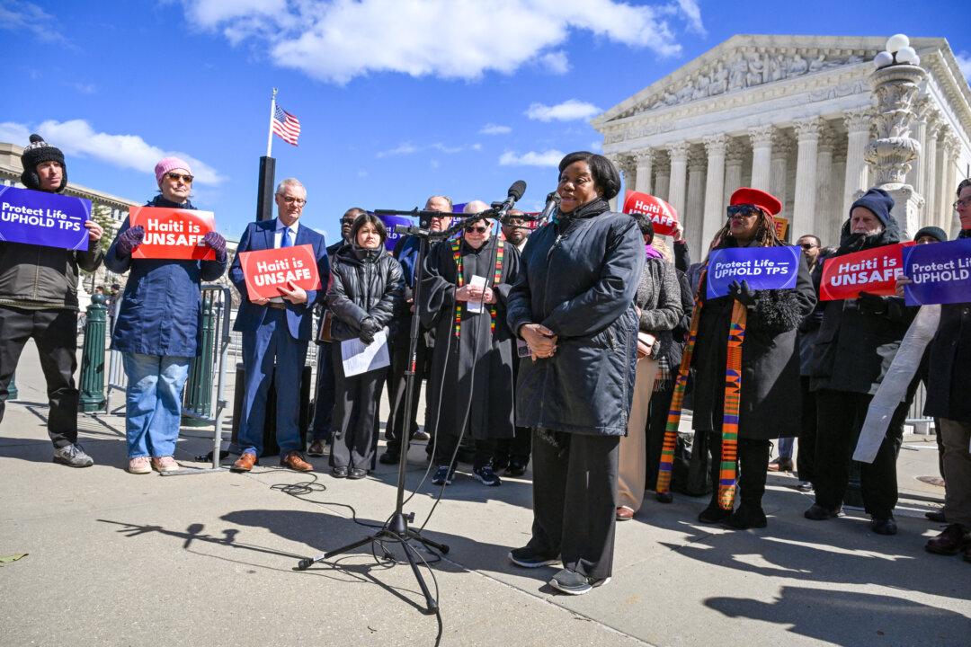 Guerline Jozef, co-founder and Executive Director of Haitian Bridge Alliance, speaks in front of the U.S. Supreme Court in Washington on March 16, 2026. The Court agreed on March 16 to consider the Trump administration’s bid to strip Haitians and Syrians of temporary deportation protections. The Department of Homeland Security has announced plans to end so-called Temporary Protected Status for some 350,000 Haitians and 6,000 Syrians. (Roberto Schmidt/AFP via Getty Images)