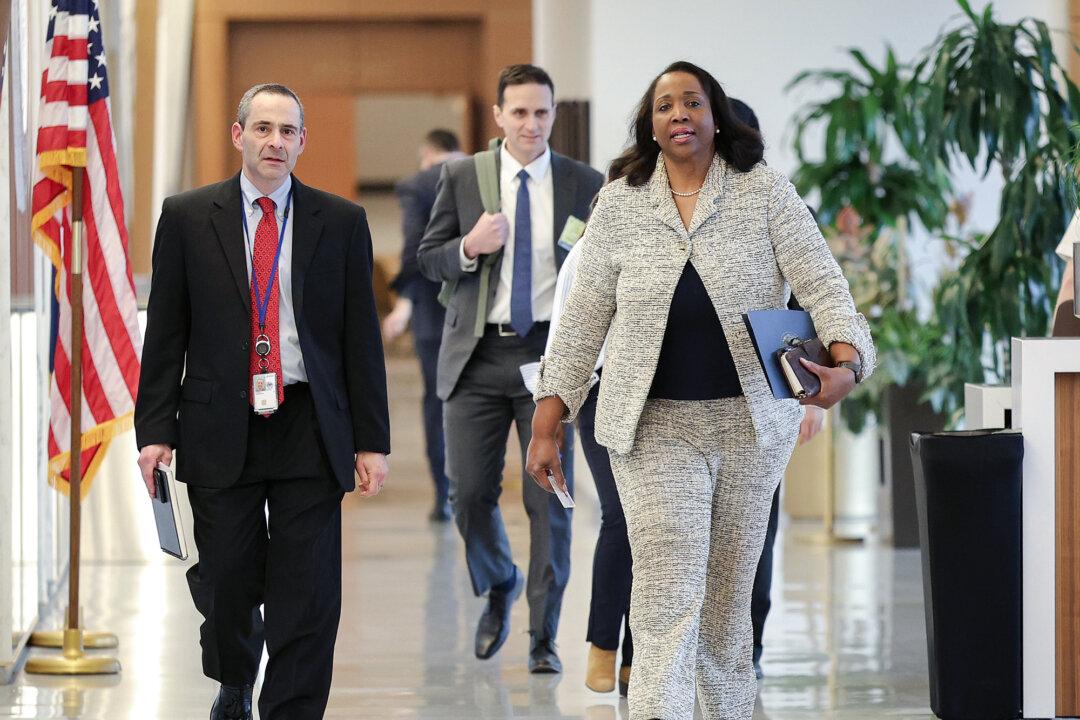 Federal Reserve Board Governor Lisa Cook (R) arrives for a board meeting at the Federal Reserve building in Washington on March 19, 2026. (Kevin Dietsch/Getty Images)