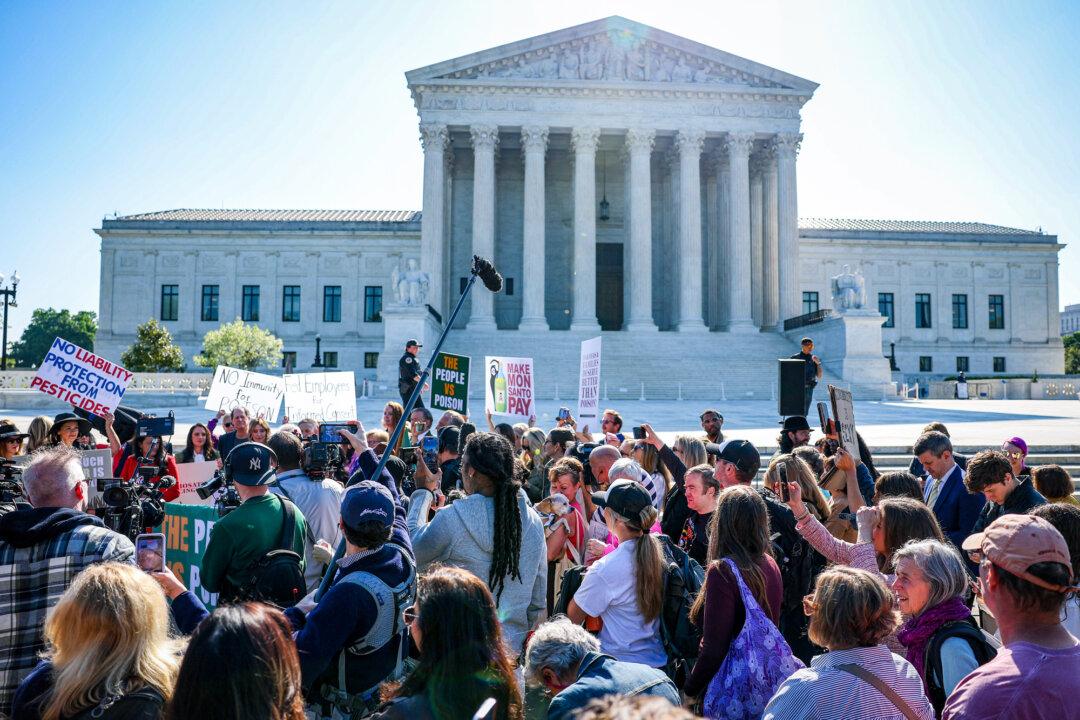 “The People vs. the Poison” protesters rallied to protest Bayer/Monsanto regarding cancer-linked risks from the Roundup weedkiller outside the U.S. Supreme Court in Washington on April 27, 2026. (Tasos Katopodis/Getty Images)