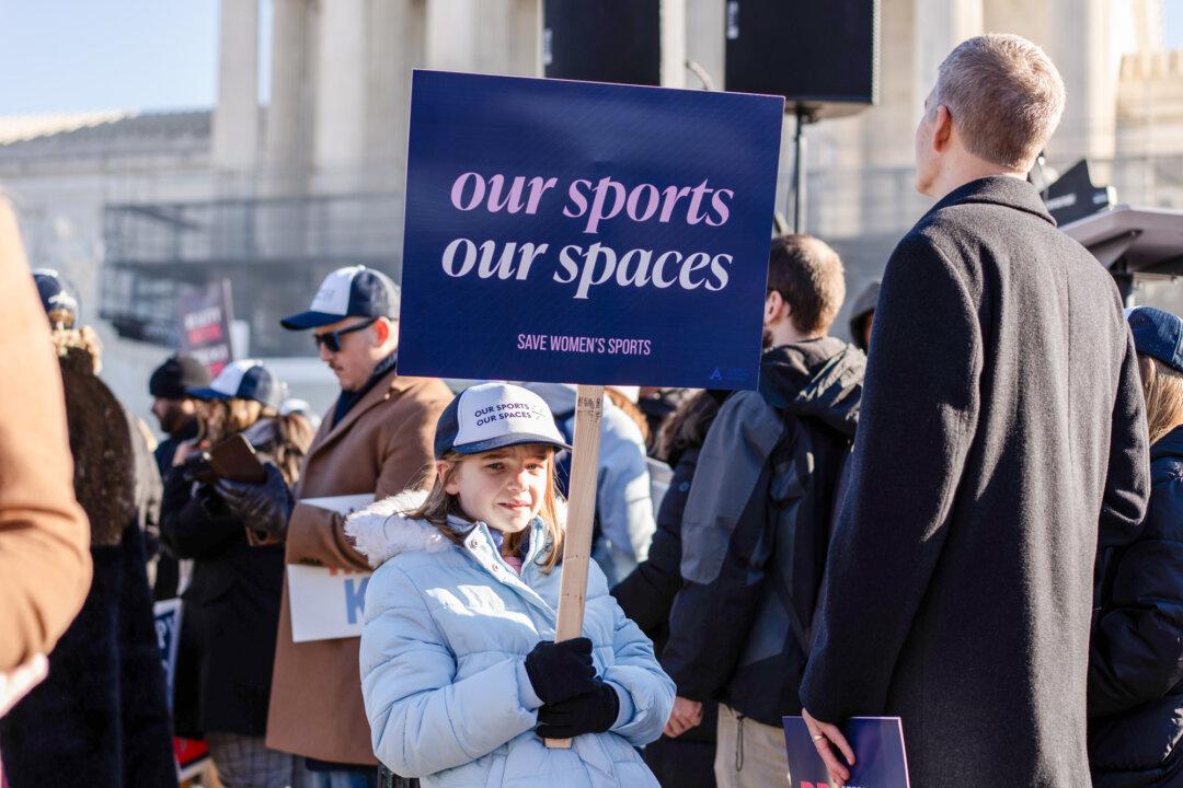 People take part in a rally outside the U.S. Supreme Court as justices hear arguments in two cases in which states have banned males from participating in female-only sports in Washington on Jan. 13, 2025. (Madalina Kilroy/The Epoch Times)
