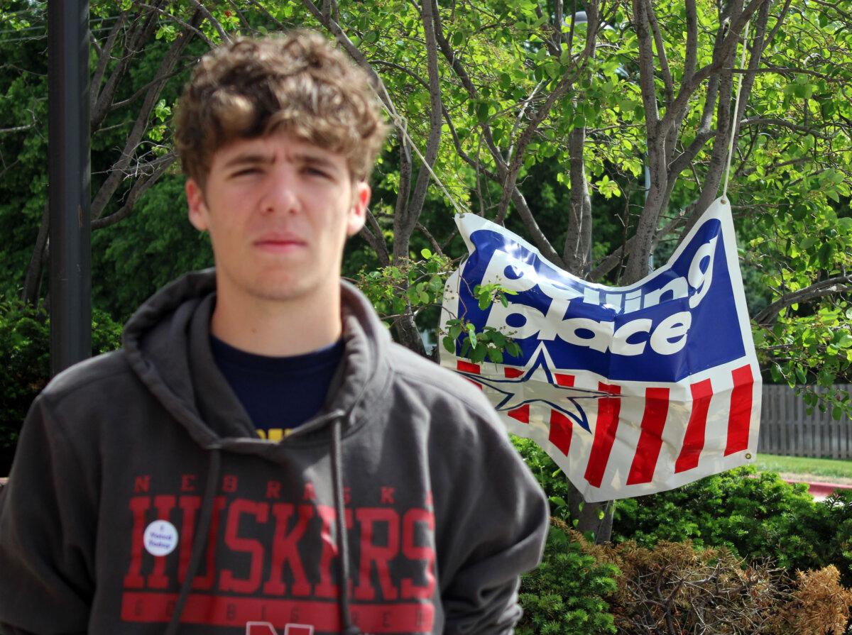 Jackson Lindsay cast his first vote in the Ward 1 Precinct 27 polling place during the Nebraska primary election on May 12, 2026. (Michael Clements/The Epoch Times)