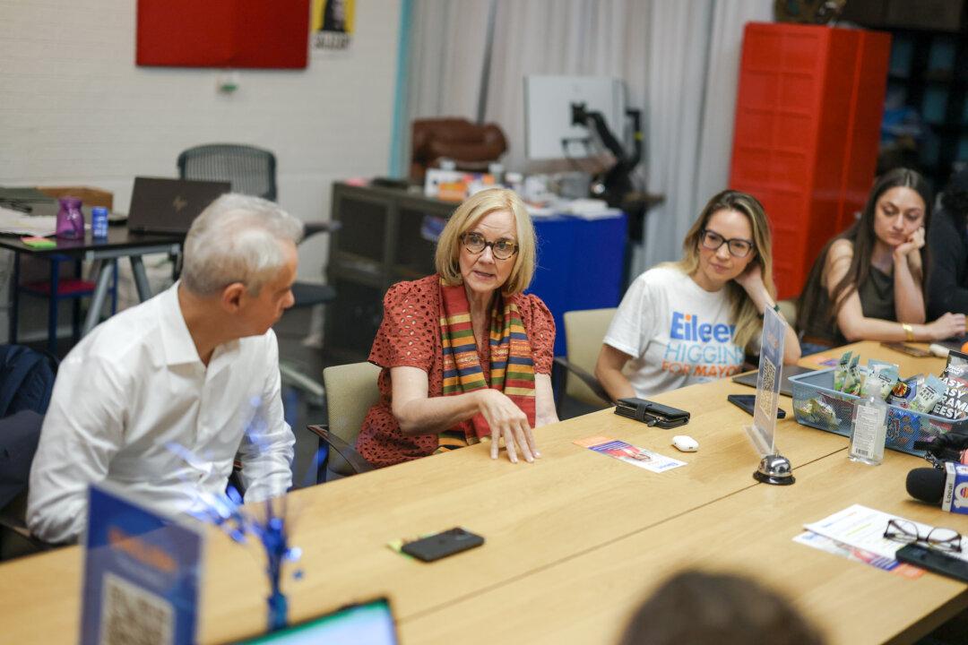 City of Miami Mayoral candidate Eileen Higgins (2nd L) and former Chicago Mayor and Ambassador to Japan Rahm Emanuel (L) work an election headquarters phone bank trying to get voters out to the polls in Miami on Dec. 8, 2025. (Joe Raedle/Getty Images)