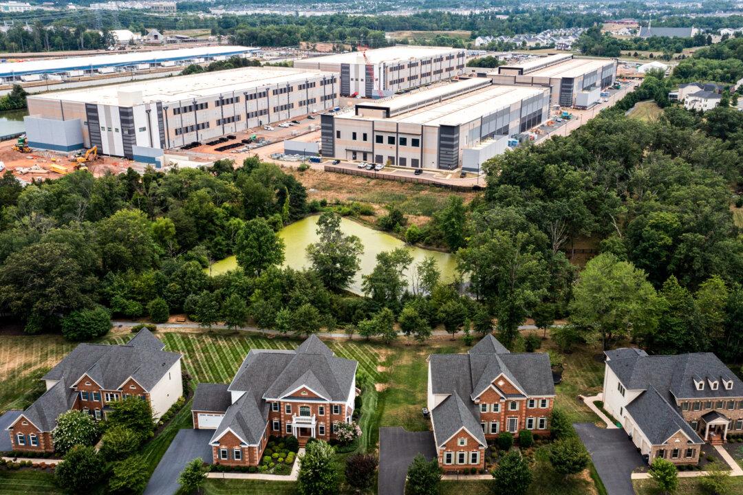 An Amazon Web Services data center is seen near single-family homes in Stone Ridge, Va., on July 17, 2024. Virginia alone has a combined total of 711 currently operational, under-construction, and planned centers. (Nathan Howard/Getty Images)