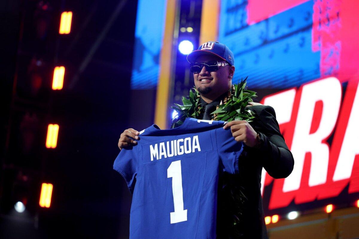 Francis Mauigoa of Miami celebrates after being selected 10th overall pick by the New York Giants during Round One of the 2026 NFL Draft at Acrisure Stadium in Pittsburgh on April 23, 2026. (Emilee Chinn/Getty Images)