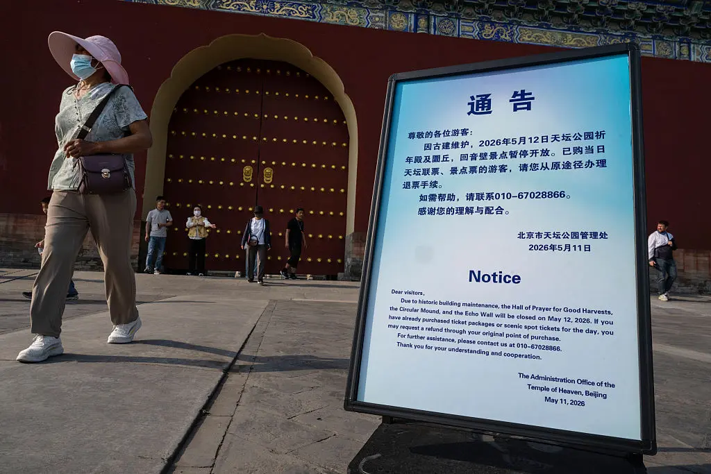 A maintenance notice is seen outside the closed doors of the Hall of Prayer for Good Harvests at the Temple of Heaven on May 12, 2026, in Beijing, China. In a rare occurrence, the popular historic site has been closed for the next three days in preparation for a tour by U.S. President Donald Trump and Chinese leader Xi Jinping. (Kevin Frayer/Getty Images)