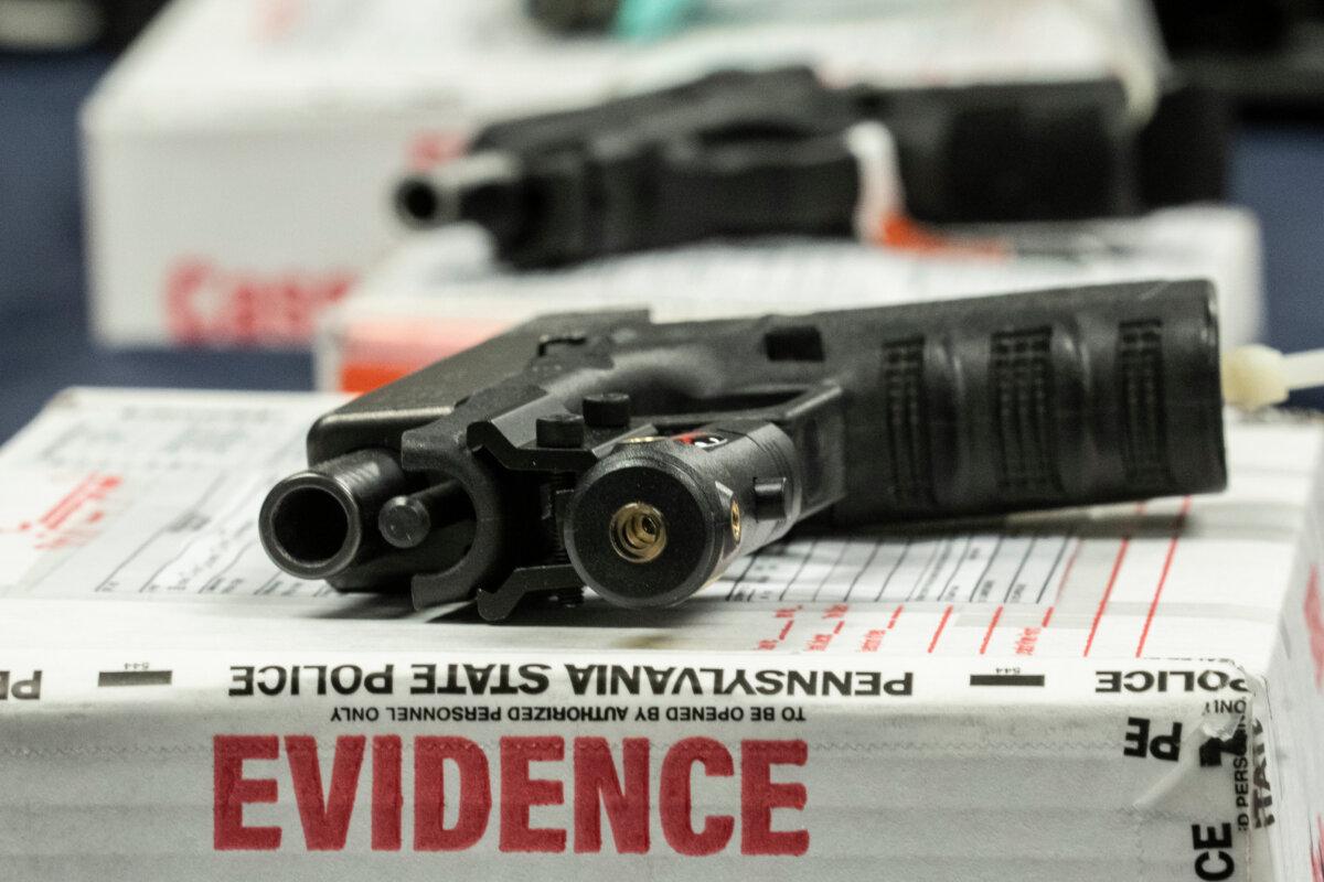 Alleged straw-purchased weapons are displayed during a news conference in Norristown, Pa., on Feb. 22, 2023. (AP Photo/Matt Rourke, File)