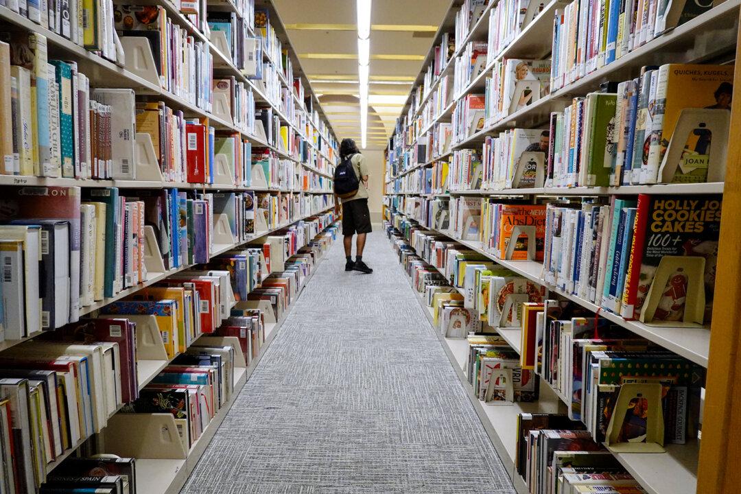 A reader browses books at a Miami-Dade Public Library in Miami on July 19, 2023. U.S. copyright law only protects works that involve human authorship, but what degree of human authorship is required is still a grey area. (Joe Raedle/Getty Images)