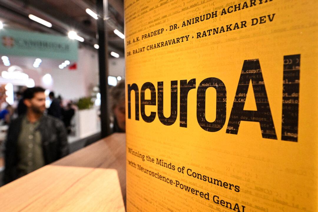 People walk past a book about AI at the Frankfurt Book Fair in Frankfurt am Main, Germany, on Oct. 16, 2024. Testimony Publishers' Christina Johnson believes the real issue for publishers and authors is not just if, but how AI is used. (Kirill Kudryavtsev/AFP via Getty Images)