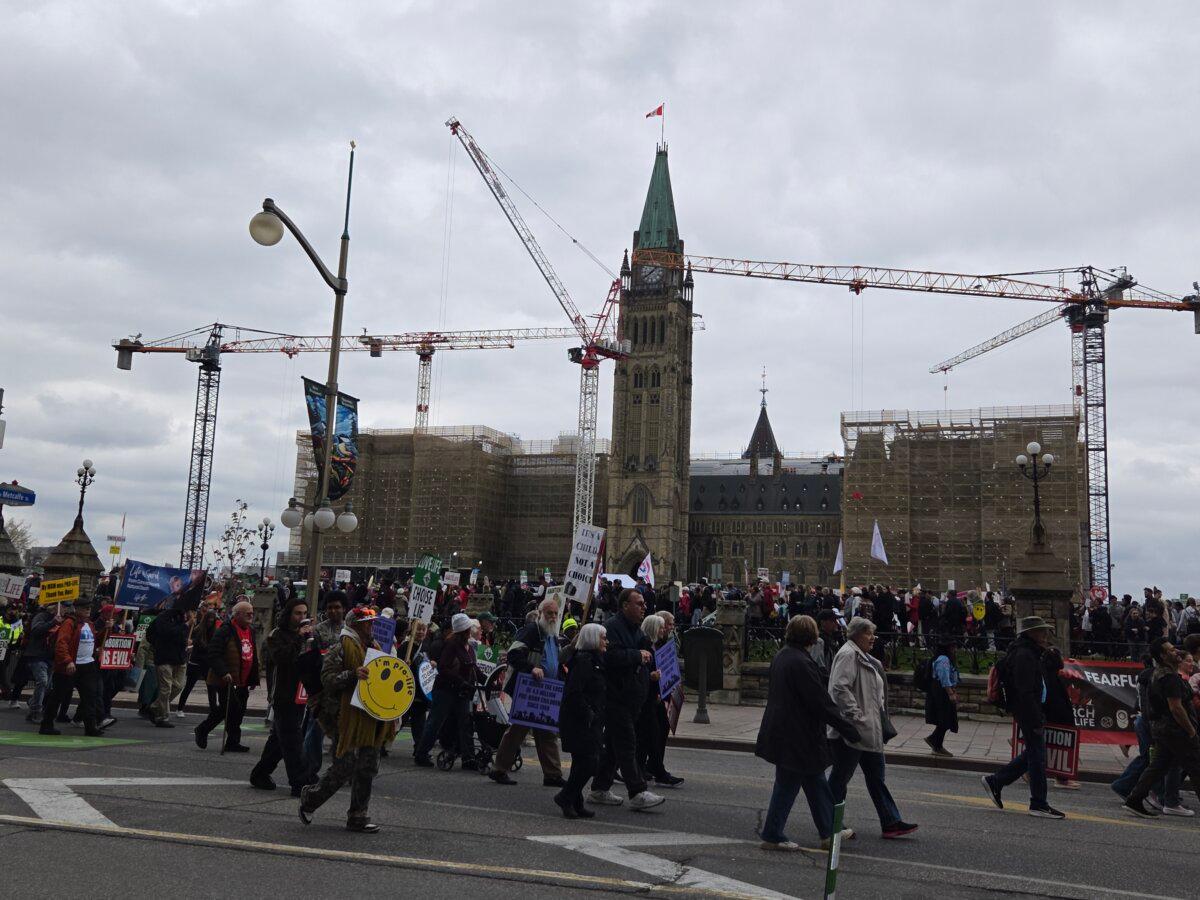 Pro-life supporters march past Parliament Hill at the annual March for Life rally on May 14, 2026. (Matthew Horwood/The Epoch Times)