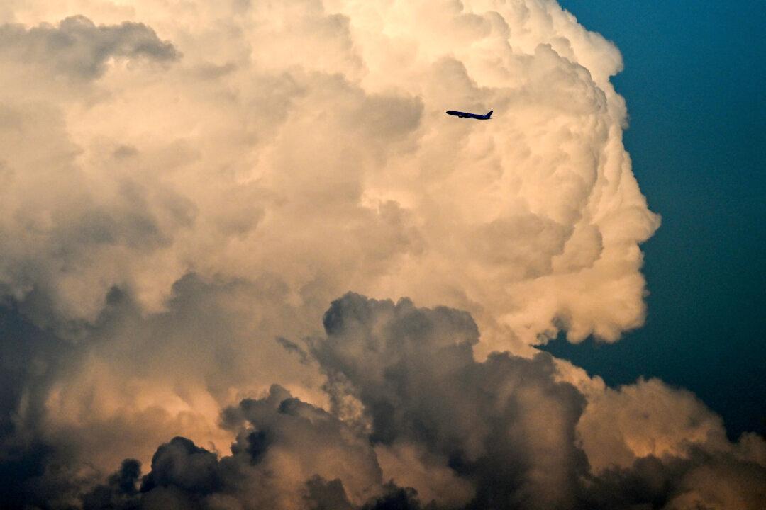 A Boeing 777-3B5(ER) aircraft by Korean Air airline flies at sunset in front of clouds shortly after take-off from Frankfurt International Airport in Frankfurt am Main, western Germany, on May 15, 2026. (Photo by Kirill KUDRYAVTSEV / AFP via Getty Images)