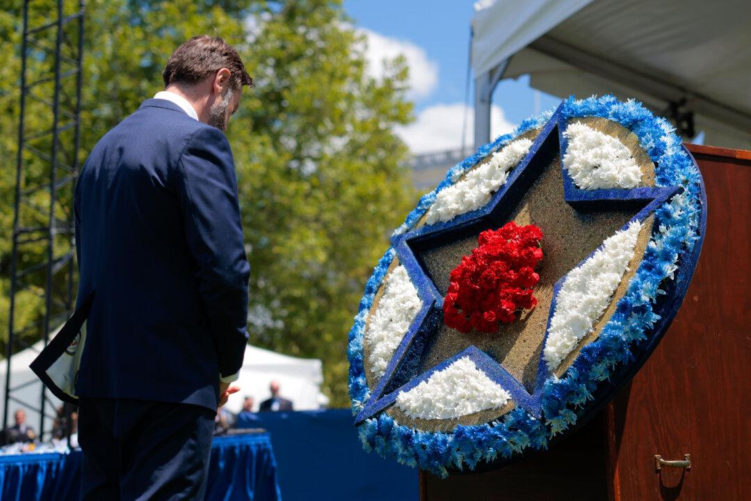 WASHINGTON, DC - MAY 15: U.S. Vice President JD Vance bows his head after laying a flower in a memorial wreath during the National Peace Officer's Memorial Service on the West Front Lawn of the U.S. Capitol on May 15, 2026 in Washington, DC. National Police Week celebrates law enforcement officers and honors those who have fallen in the line of duty. (Photo by Heather Diehl/Getty Images)