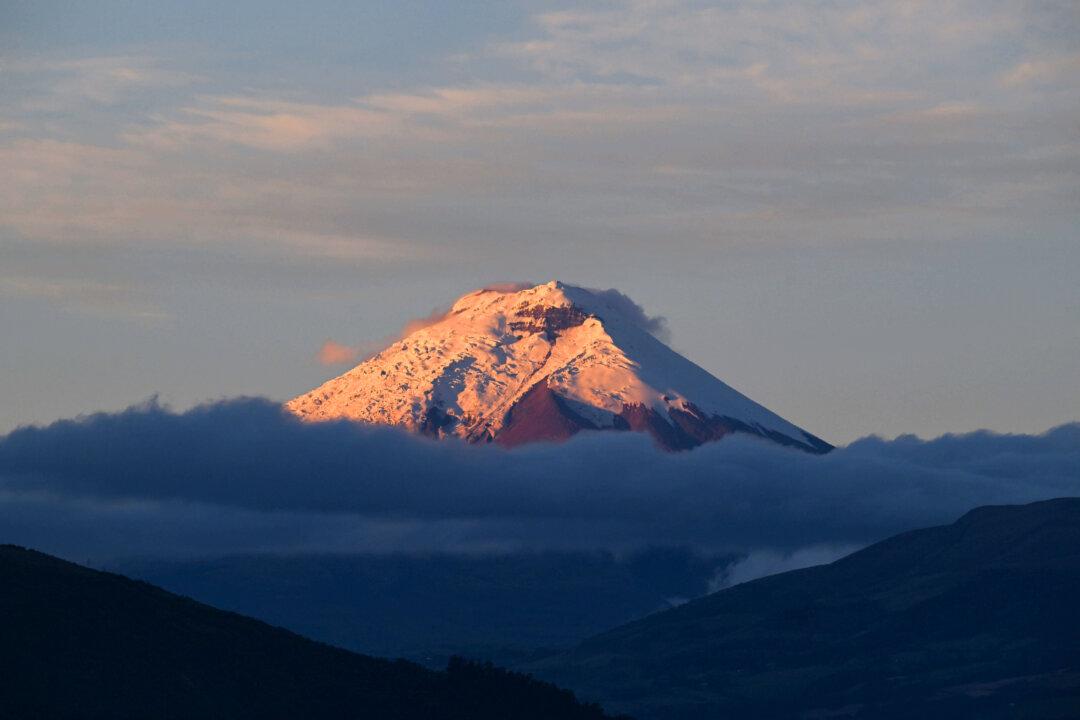 View of the Cotopaxi volcano during sunrise in Quito on May 15, 2026. (Photo by Rodrigo BUENDIA / AFP via Getty Images)