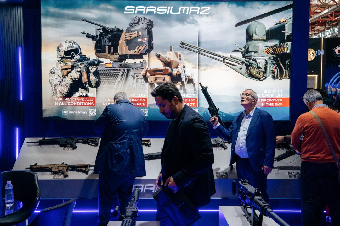 BUCHAREST, ROMANIA - MAY 15: Participants examine equipment on display at the Sarsilmaz exhibition stand during Black Sea Defense, Aerospace And Security (BSDA) exhibition on May 15, 2026 in Bucharest, Romania. The exhibition, which was established in 2007 and is held every two years, brings together suppliers and users across land, air, sea, homeland, cyber, and space-defense sectors. (Photo by Andrei Pungovschi/Getty Images)