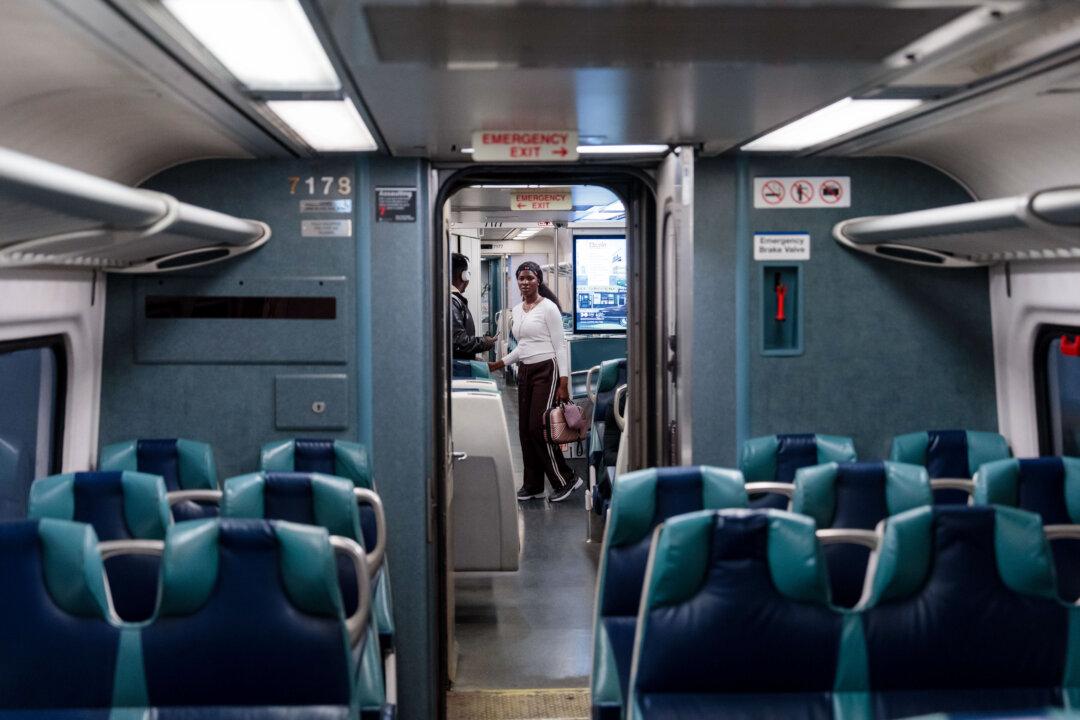 NEW YORK, NEW YORK - MAY 15: Commuters on board a Long Island Rail Road (LIRR) train at Penn Station on May 15, 2026 in New York City. Commuters face major disruption as unions representing more than 3,500 workers prepare to strike from May 16, threatening to shut down the Long Island Rail Road America's busiest passenger rail service unless transit officials and labor leaders reach a last-minute contract agreement. (Photo by Adam Gray/Getty Images)