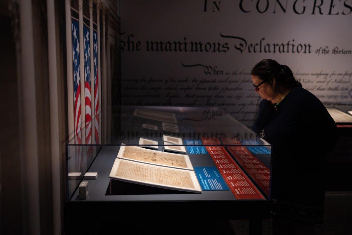 A visitor to the Houston Museum of Natural Science examines a document key to America's founding. (Mike Rathke)