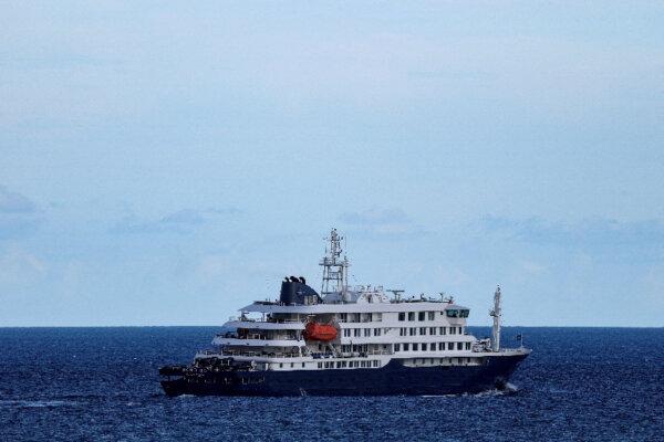 The cruise ship MV Hondius, which had a hantavirus outbreak, leaves the port of Granadilla de Abona, in Tenerife, Spain, on May 11, 2026. (Hannah McKay/Reuters)